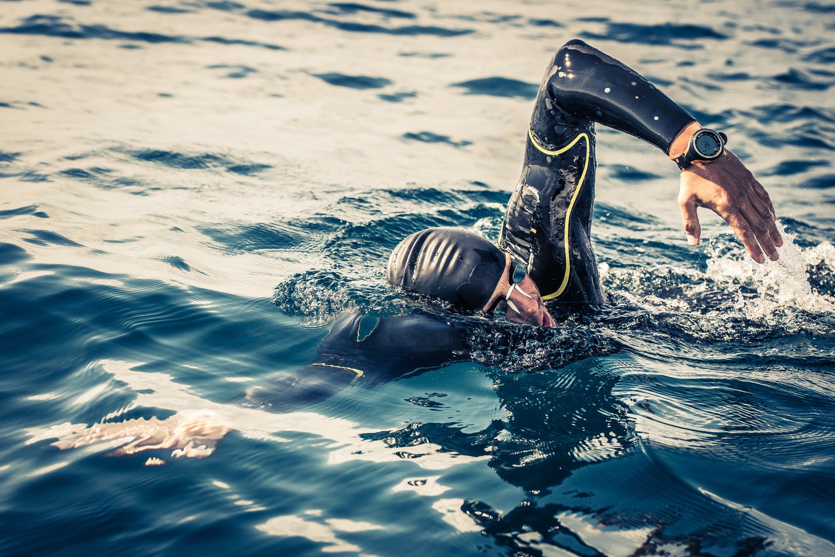 Open water swimmer swimming in sea